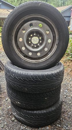 16" 5-Bolt Dodge Caravan Rims With Aspen Touring A/S 215/60R15 Tires. 4 Total