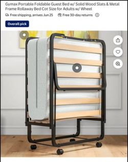 New and assembled Twin folding cot with metal frame and wood backing
