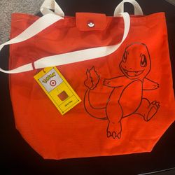 Pokemon tote bag, pin, mystery bottle and headphones
