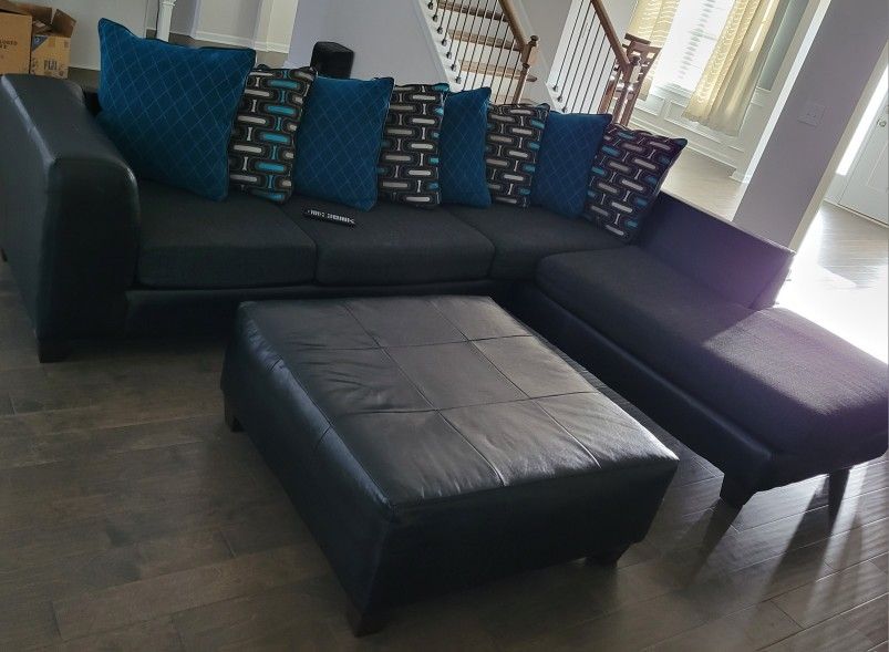 Black Sectional, Ottoman And 2 Pieces Of wall Art