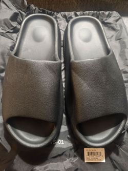 Brand new, never worn YZY YS-01 Slides in Black. These are 100% authentic, ordered directly from the independent Yeezy website.Unlike the older Adidas