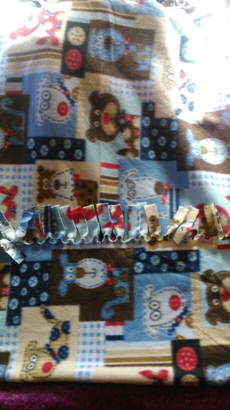 Baby tie blanket with dogs on it