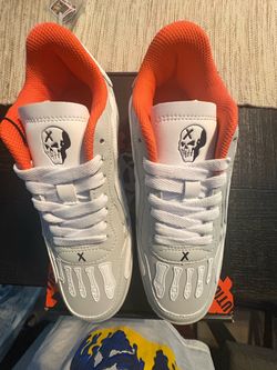 Watson BrandX Bones men 6 White and orange sneakers with black skull graphic #skulls #athletic