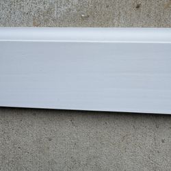Primed Wood Baseboard. 