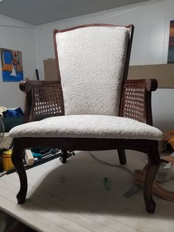 Upholstered wooden Arm chair