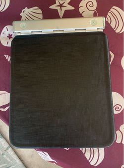 Vintage  accounting ledger binder with patterned interior lining and lined columnar record paper