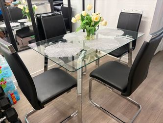 Glass Table Chrome Four Black Chairs
