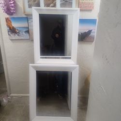 A Pair Of Wall Mirrors 