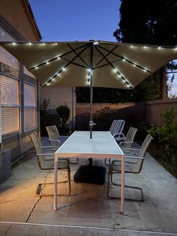 Outdoor table, 4 chairs, solar umbrella