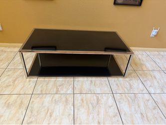 Black glass and chrome coffee table.