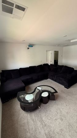 Sectional couch and glass top coffee table
