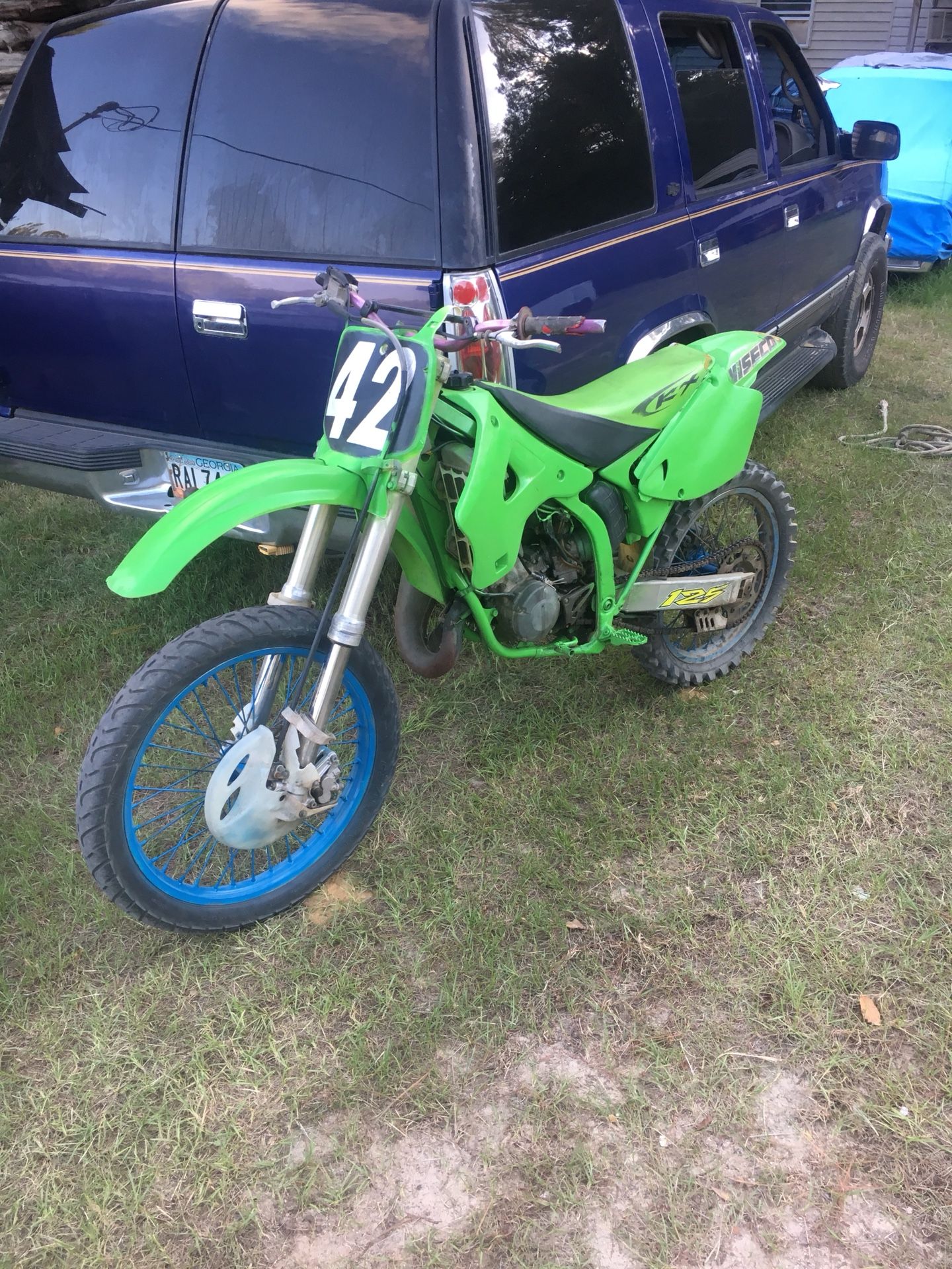 2000 Kawasaki dirtbike 125 two-stroke will trade for a four wheeler The dirtbikeIs very fast do not smoke runs good