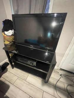 tv/ glass table/ jvc receiver
