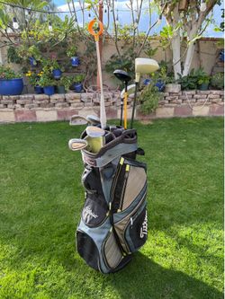 Titleist Golf Bag & Assorted Golf Clubs & Retriever