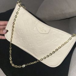 Easy Pouch On Strap handbag in Monogram Empreinte leather