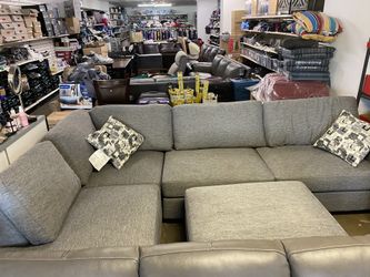 Gray sectional with ottoman
