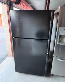 Black GE Refrigerator And Freezer