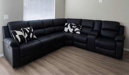 Black leather fully reclining sectional couch