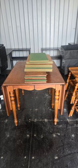 Dropdown  leaf maplewood table and four chairs