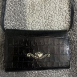 Brighton black crocodile-embossed leather convertible bag.