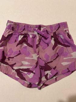 Under Armour girls' purple camo print athletic shorts, size L