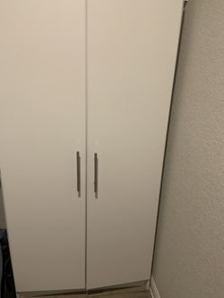 Cabinet with 4 shelves available immediately.