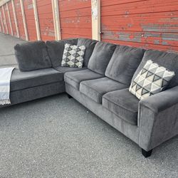 Ashleys Gray sectional sofa couch left facing chaise