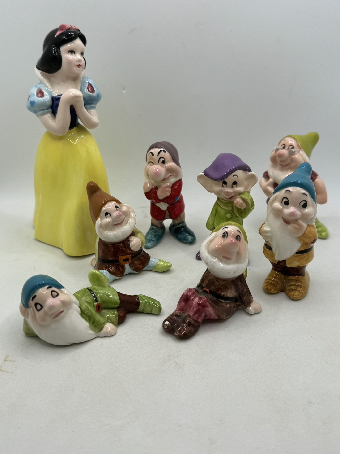 Vintage Walt Disney Snow White and the Seven Dwarfs Figurines • Ceramic • Japan. Snow White is approximately 6”, and the doors are approximately 3”. V