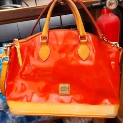 USED Dooney & Bourke orange and brown patent leather handbag