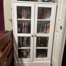 White book shelf with glass doors