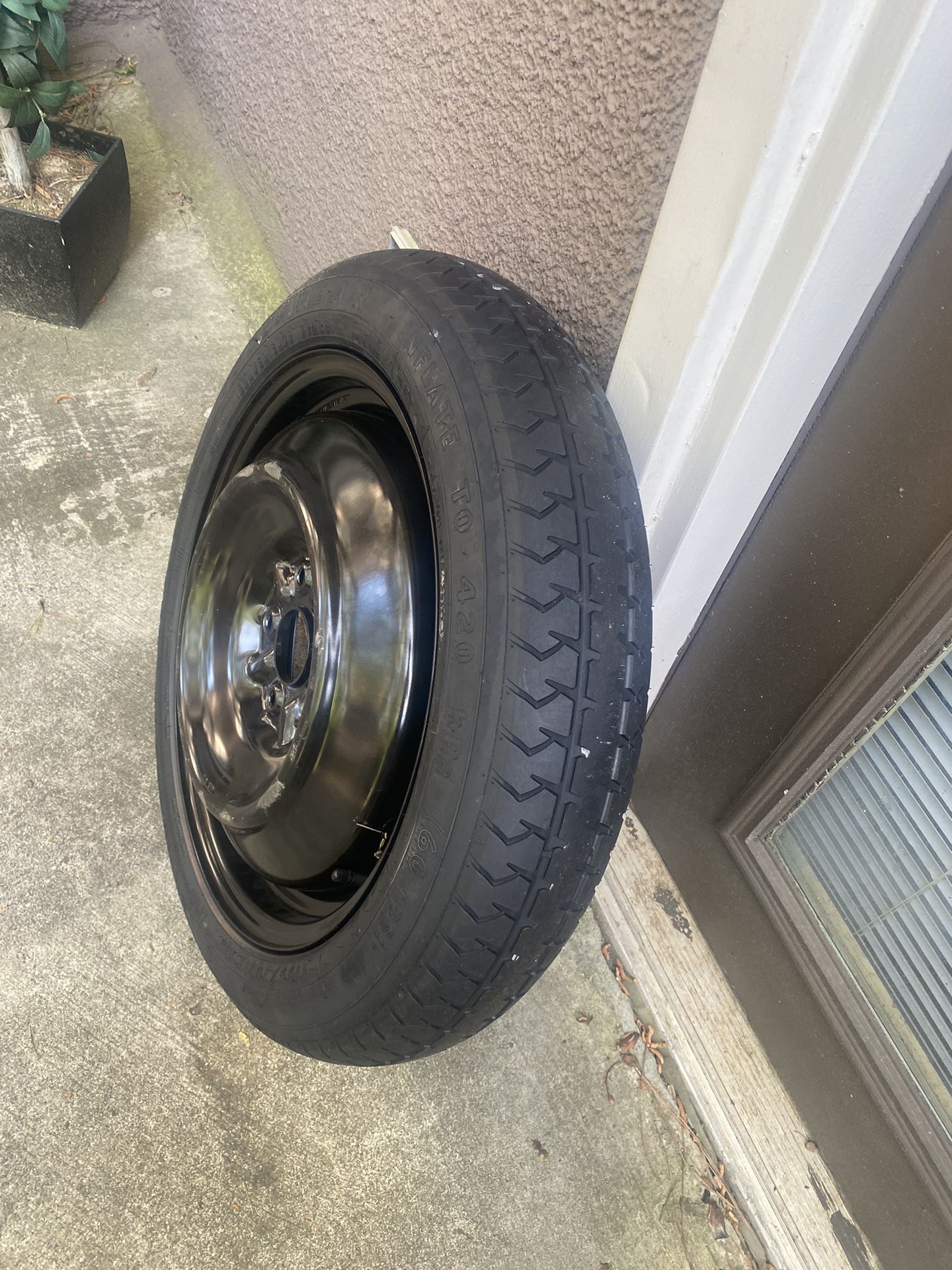 Spare tire with rim inflate to 420 kpa (60Q psi)