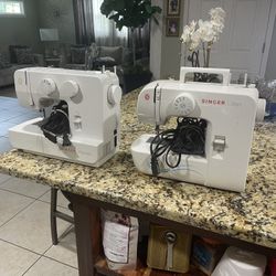 2 Singer Sewing Machines 