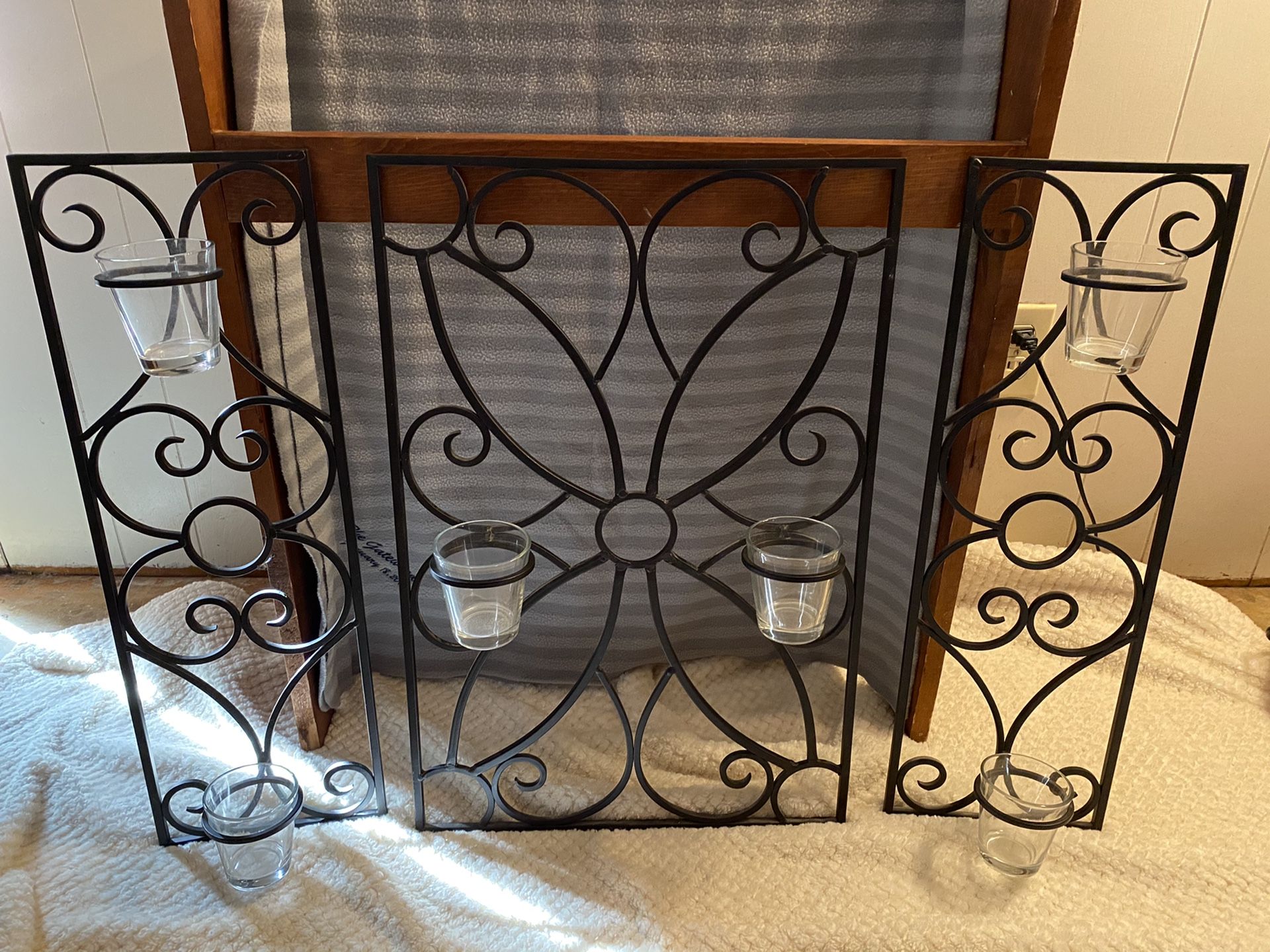 Black rod iron wall decor with candle holders