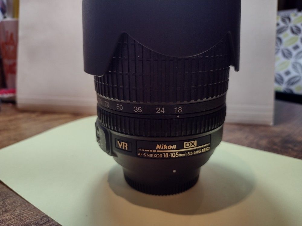 Nikon 18-105mm f/3.5-5.6G ED VR Lens amd caps
