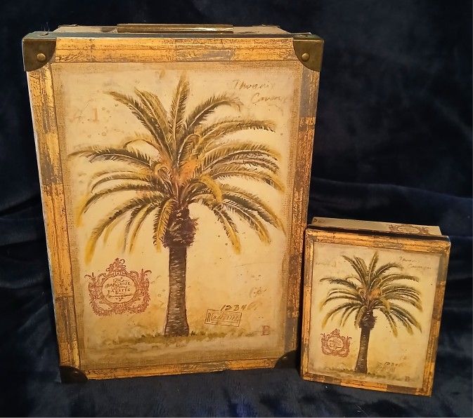 Used like New. A Set of Collectible Decorated Storage Boxes with a Palm Tree Design.