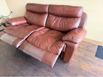 Brown leather dual reclining couch