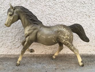 Breyer glossy dapple running mare