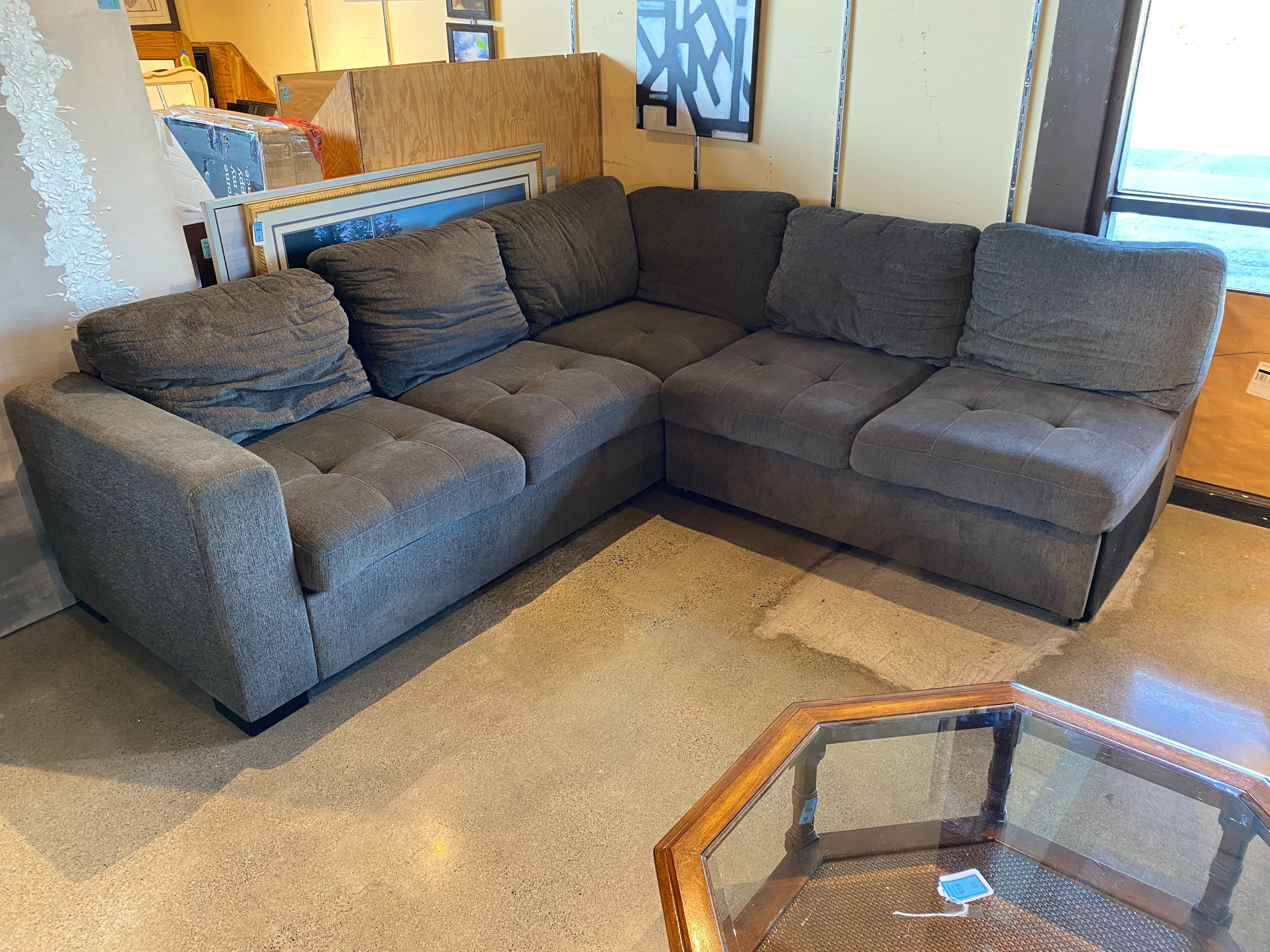 Grey Tufted Sectional with Trundle Sleeper