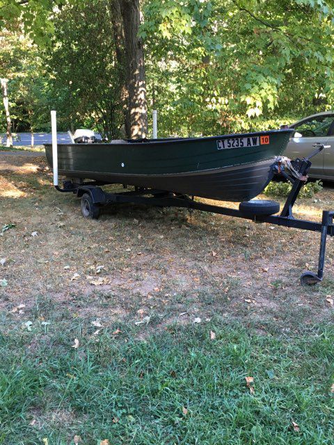 14 foot aluminum boat with 5.5 hp Johnson motor with tralier