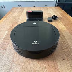 Lefant Model M213 Robot Vacuum    Works well  Comes with the charging dock