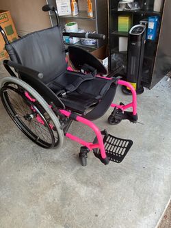 Custom Manual Wheelchair with bright Pink Frame