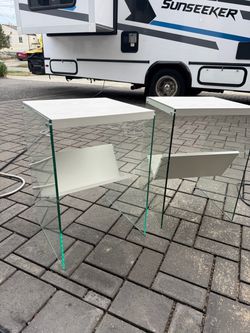Two glass end tables