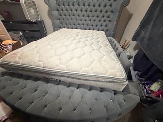 Gray bed frame for the mattress included