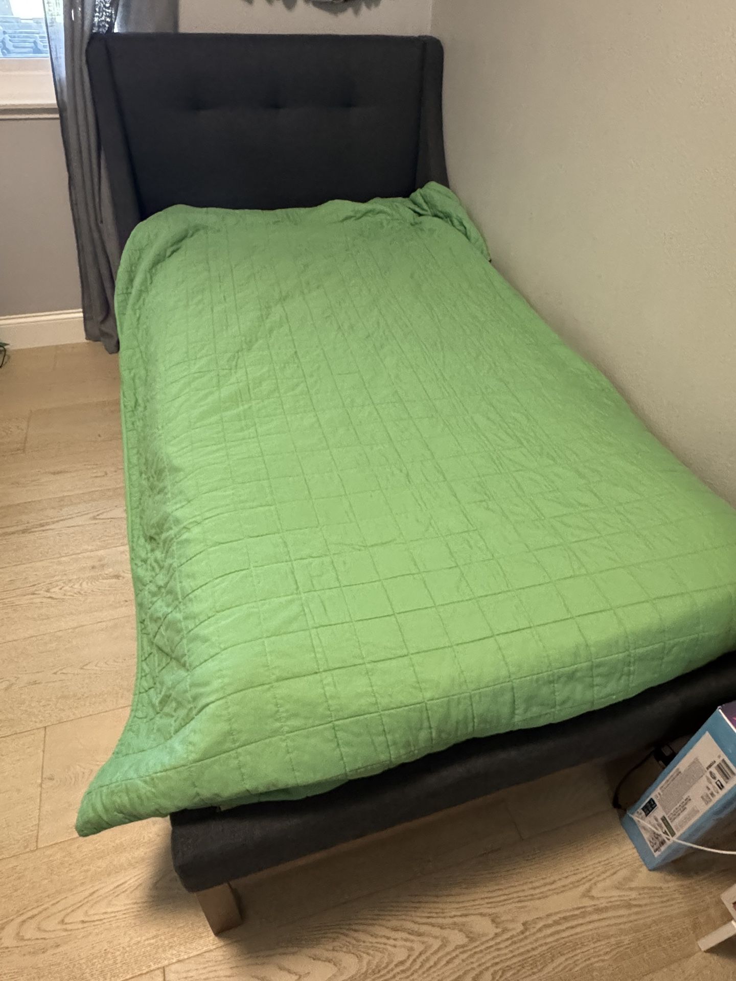 Upholstered Twin bed With Mattress.
