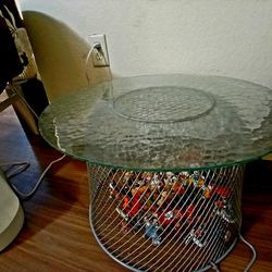 GLASS END TABLE WITH A WIRED BASE 
