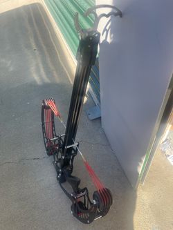 Crossbow slingshot with green laser sight and ammo