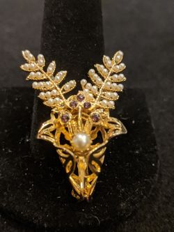 $15. Flower bouquet brooch with faux pearls and purple rhinestones and two leaf brooches.