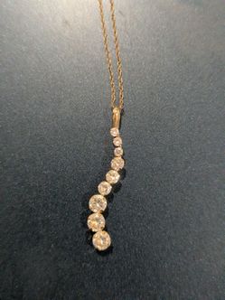 Beautiful 14kt S curve pendant, chain with CZ.