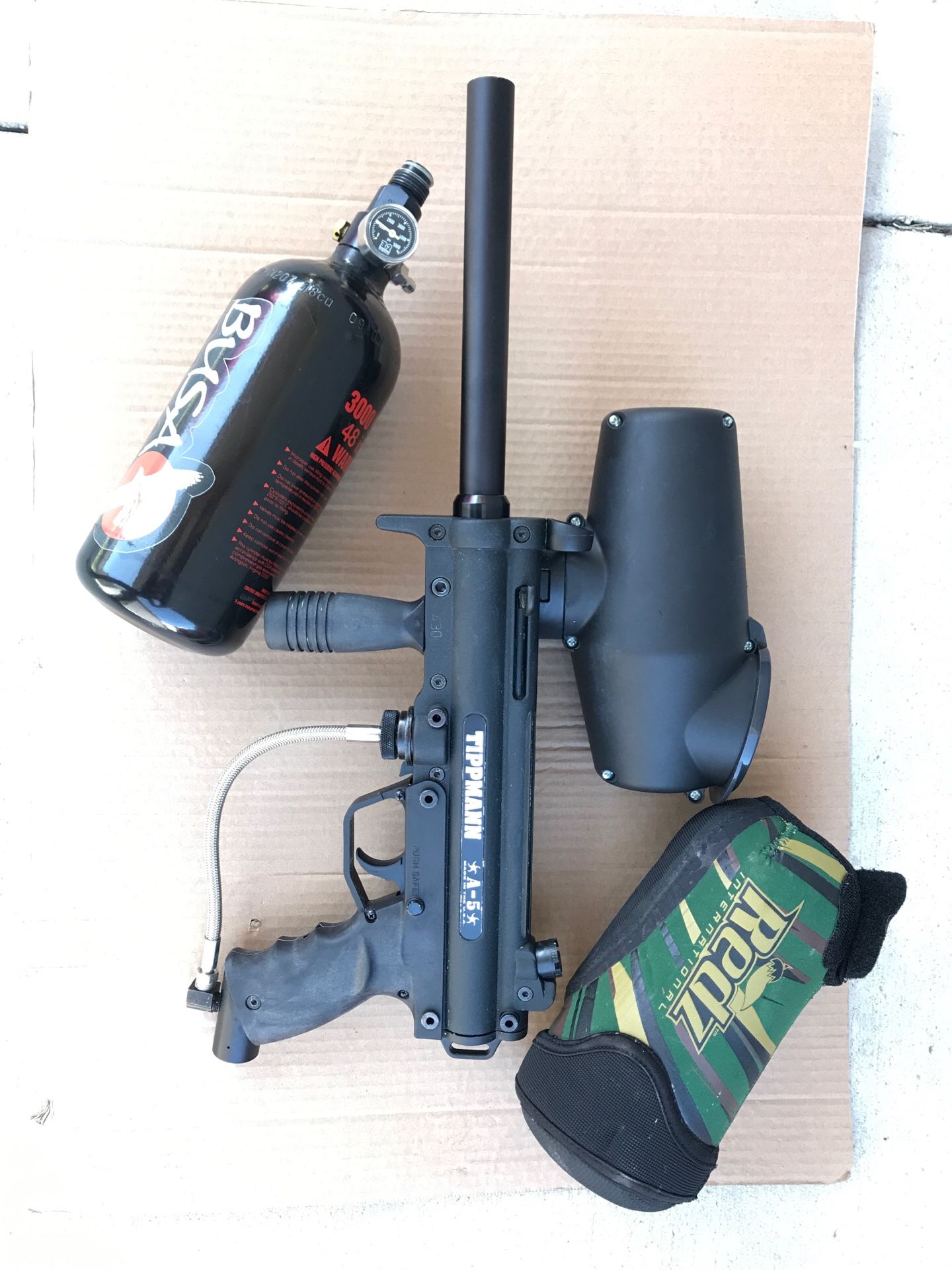 Electric trigger Tippmann A5 paintball marker paintball gun, compressed air tank and tank sleeve.