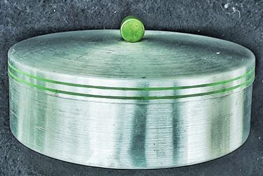 Art deco spun aluminum round box with apple green bakelite knob 8"